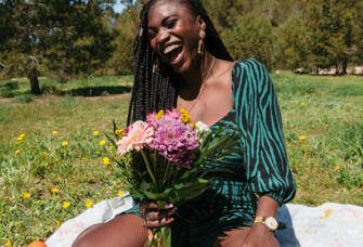 Woman holding a fresh bouquet of wild flowers