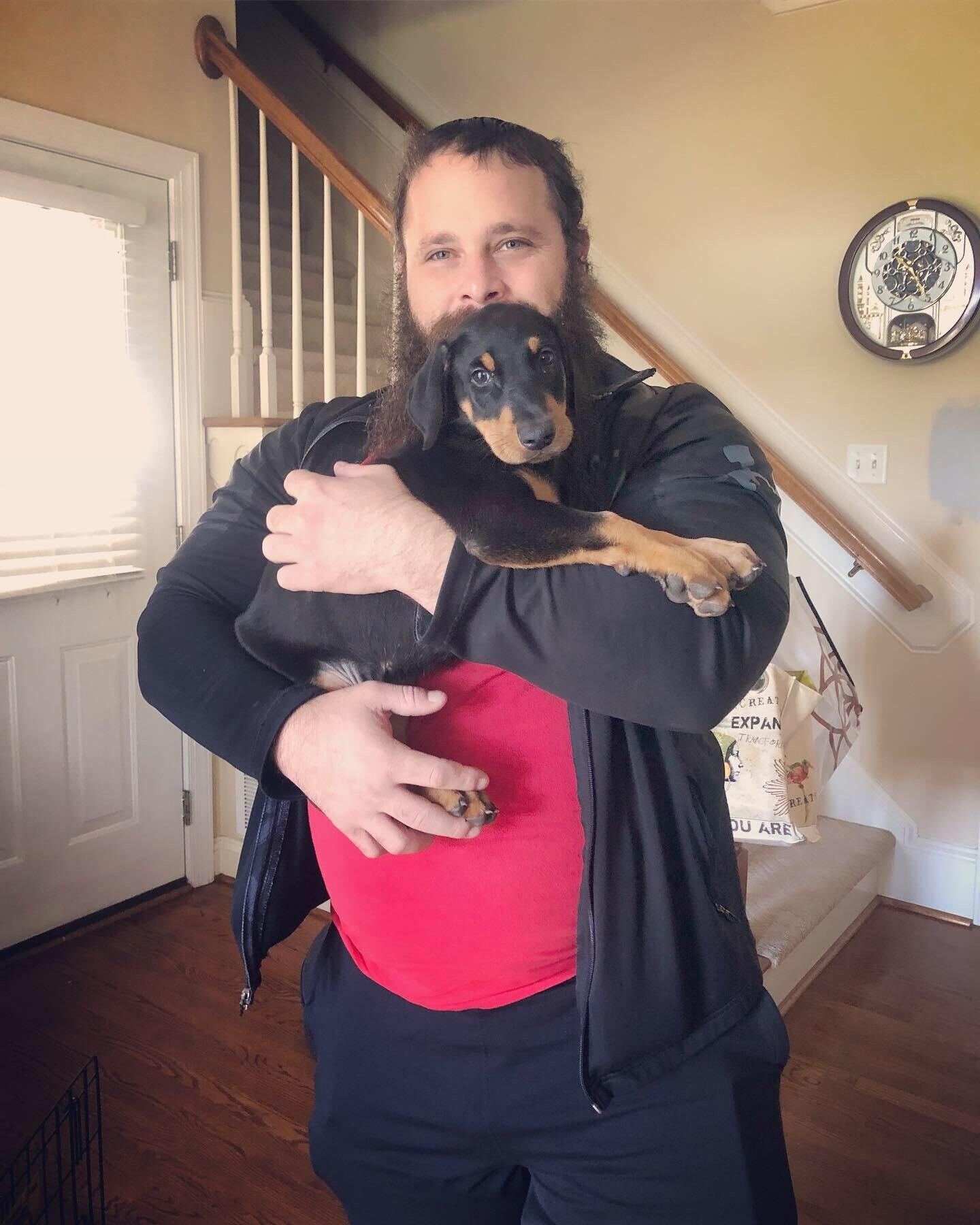 our family got a new puppy, his name is Mac and Chris became his favorite person!