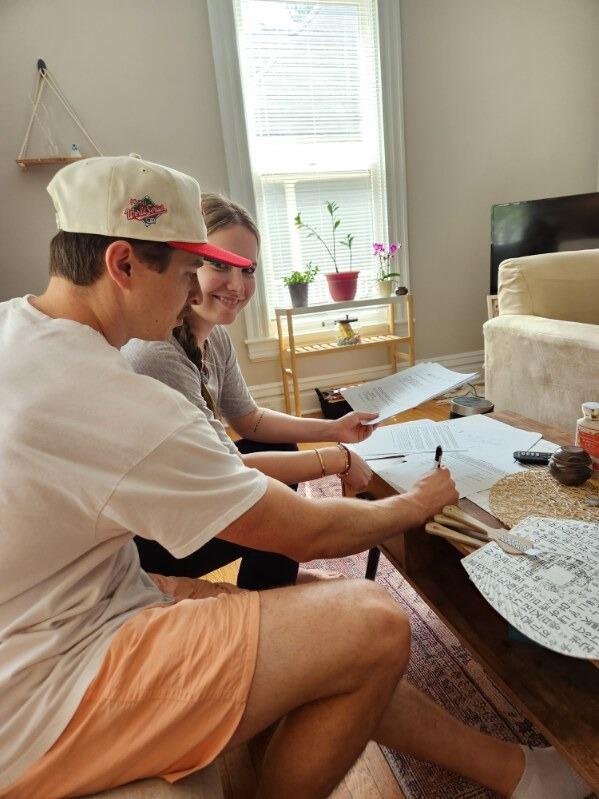 Kayla & Micah sign the lease for their first place together. 