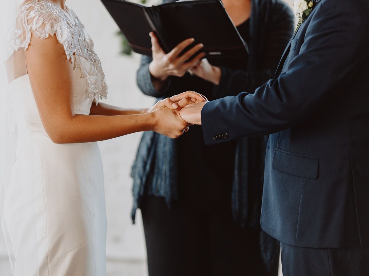 bride and groom holding hands