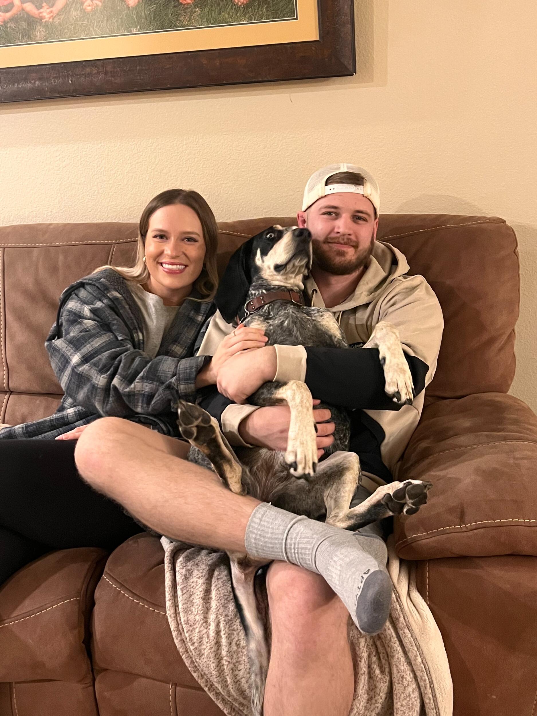 Our first family photo with our fur baby, Sophie. 