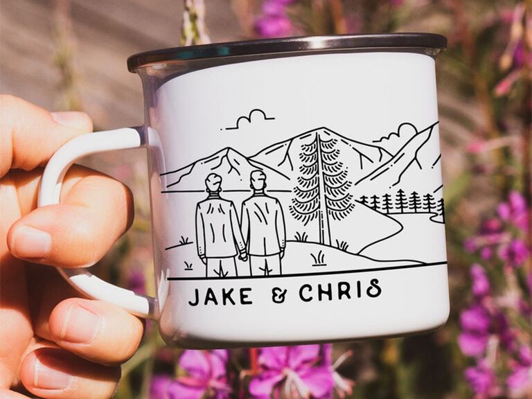 Personalized names and drawing of couple looking at mountain landscape in black on white mug