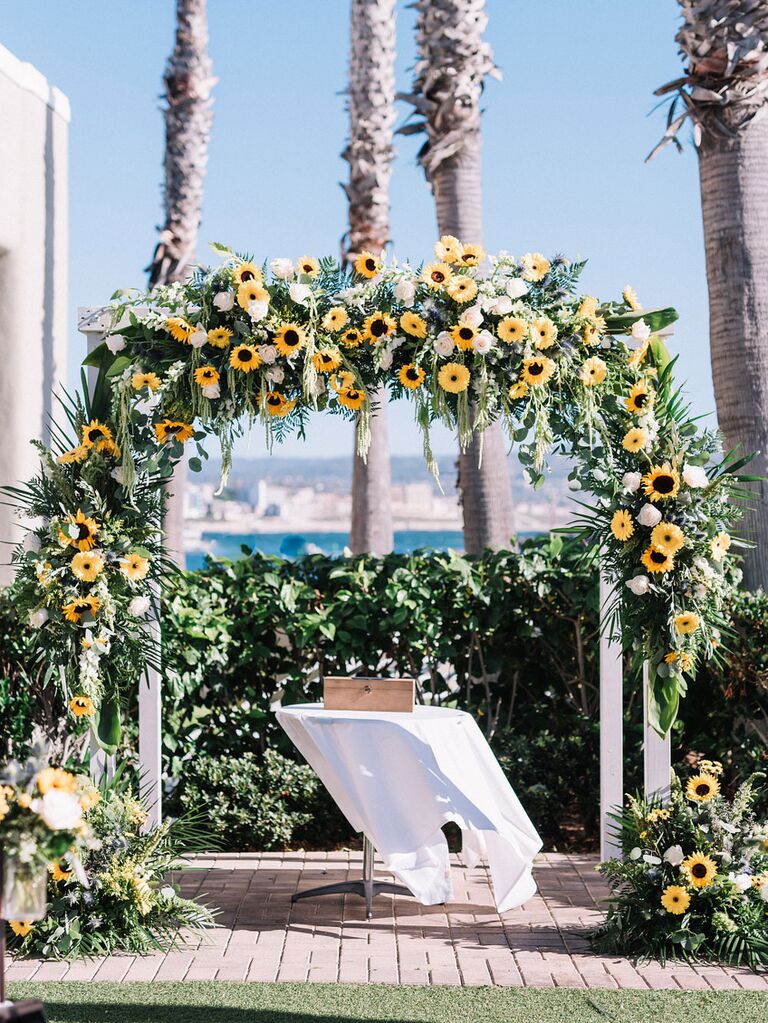 Sunflower arch over wedding ceremony altar at outdoor venue
