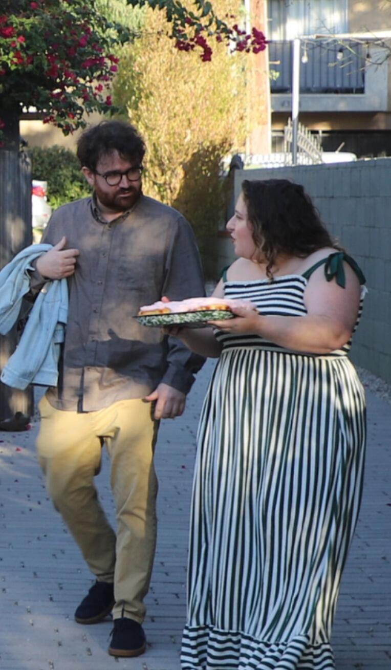 Ryan took Gabrielle to a friend's backyard where there would supposedly be a dinner party (for which she was asked to bake a cake)... she was very confused why there was no one to be seen —until Ryan proposed! (Photo courtesy of Ava & Dan, who were hiding in a shed with a camera) 