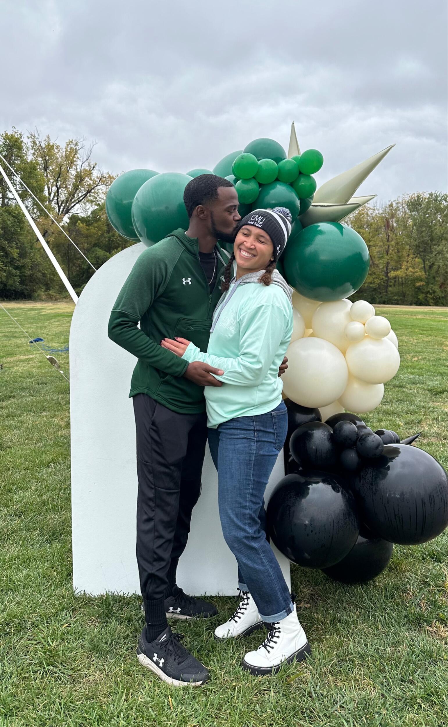 Tevin first saw Mackenzie when he stopped to ask for directions to the Macon High School track in the spring of 2022; he was recruiting, and she was working as an English teacher. They both searched social media and school websites for one another after the encounter, but they didn't talk again until Mackenzie started working in the Admissions Office at CMU, where Tevin was coaching and often stopped in to flirt... and talk recruitment, of course.