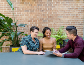 Couple going over contract with vendor