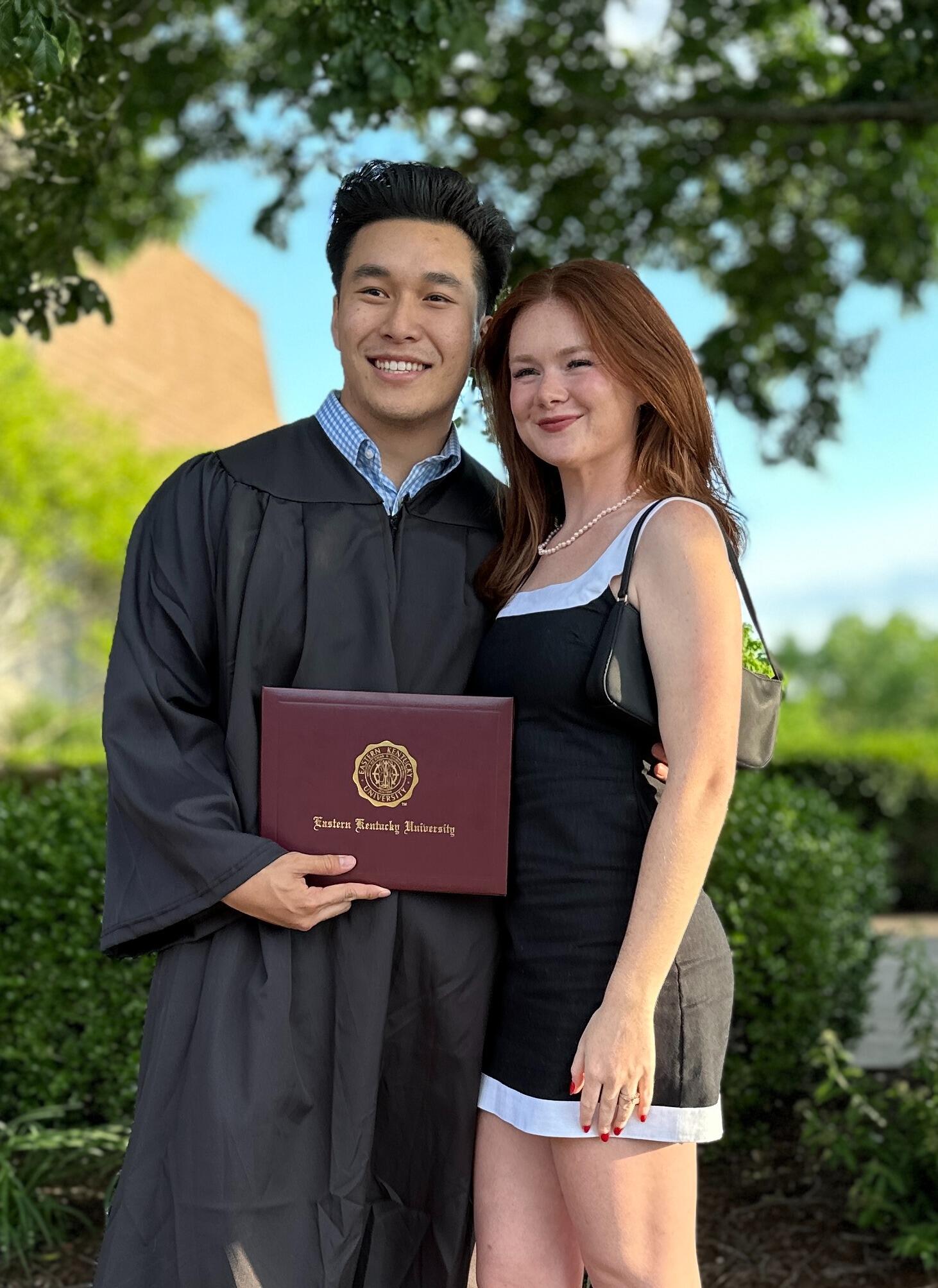 Khanh graduates college from EKU! His sidekick there to support. 