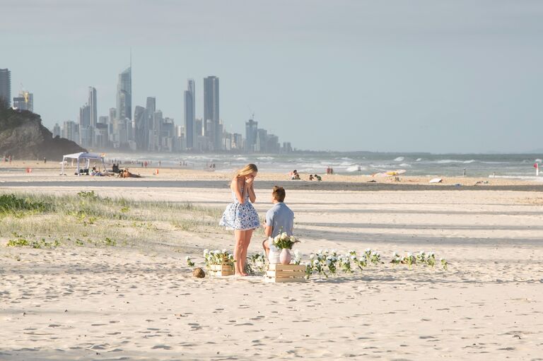 Surprise!! Josh proposed on Emma's favorite beach on the Gold Coast with all of her favorite people there!
