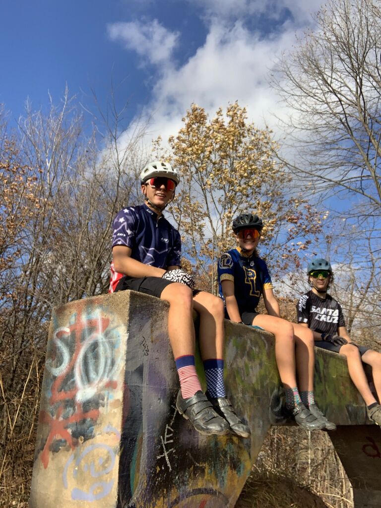 Julia and Gavin biking with Adam