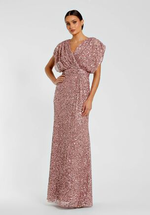 Sequin gown with v-neckline, ruched detailing, and draped short sleeves.