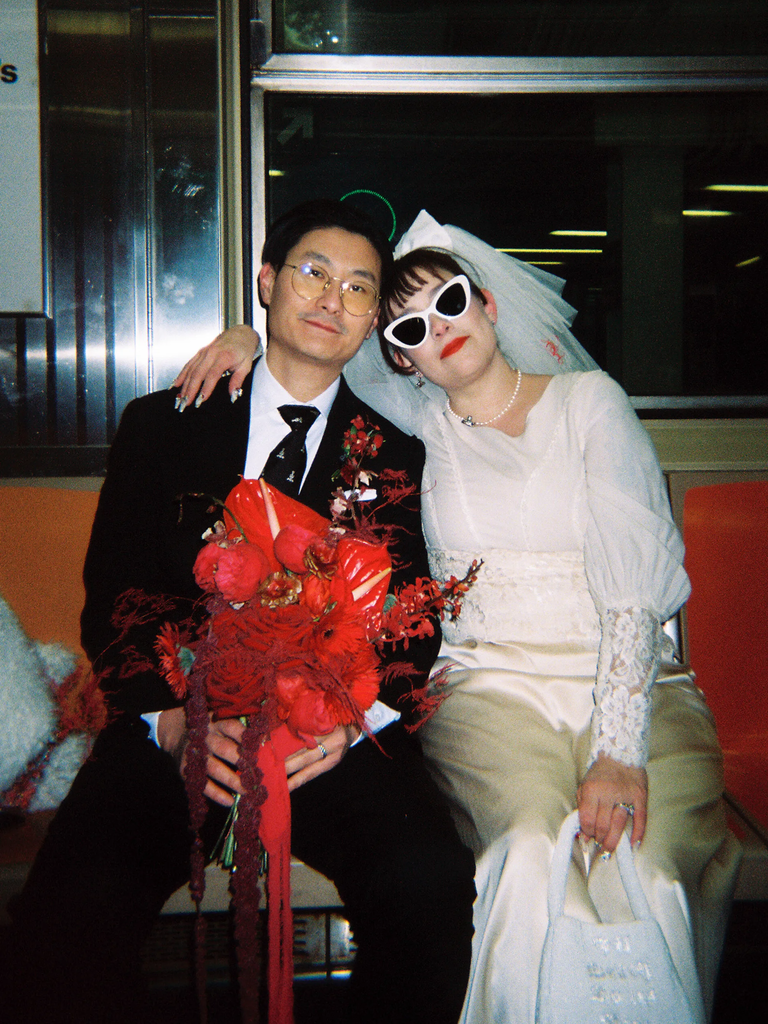 Film photo of couple on subway train