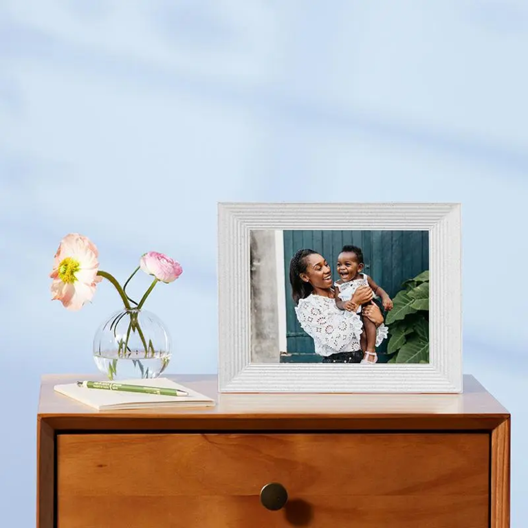 Stylish digital picture frame with light-colored frame showing picture of mother and baby cute wedding gift idea