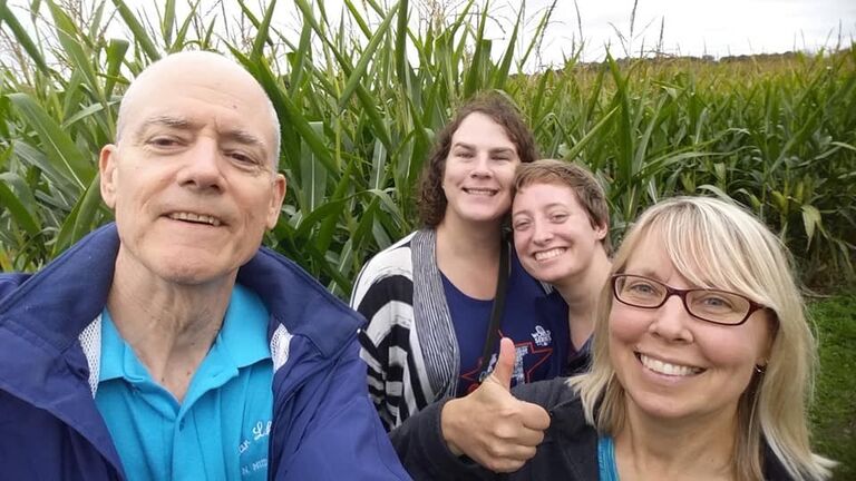 Justine, Tori, and Justine's parents Stephen and Marlene complete a corn maze