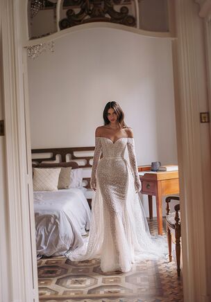 Safari — sparkling beads embroidered wedding dress with smooth silhouette and long sleeves finished with cold-shoulder heart-shaped neckline. Complemented with detachable tulle lightweight elongated trail.
