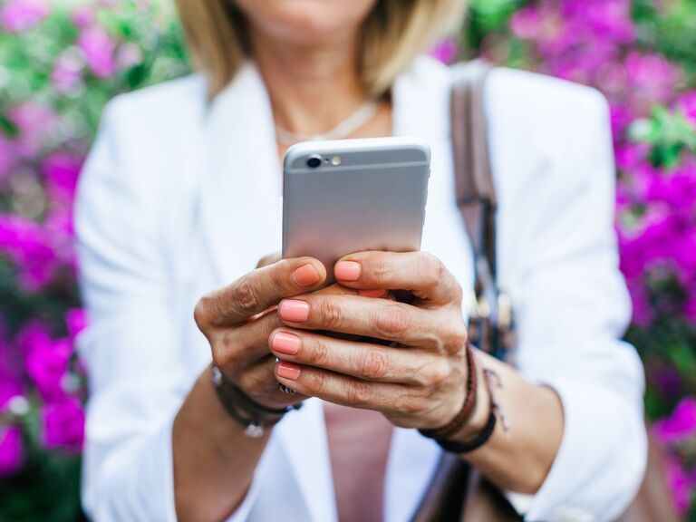 Woman holder her phone and texting