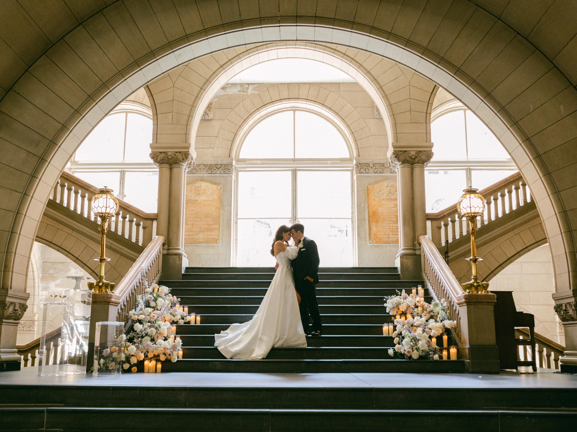 Bride and Groom kissing on steps of Pittsburgh city hall wedding venue