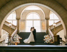 Bride and Groom kissing on steps of Pittsburgh city hall wedding venue