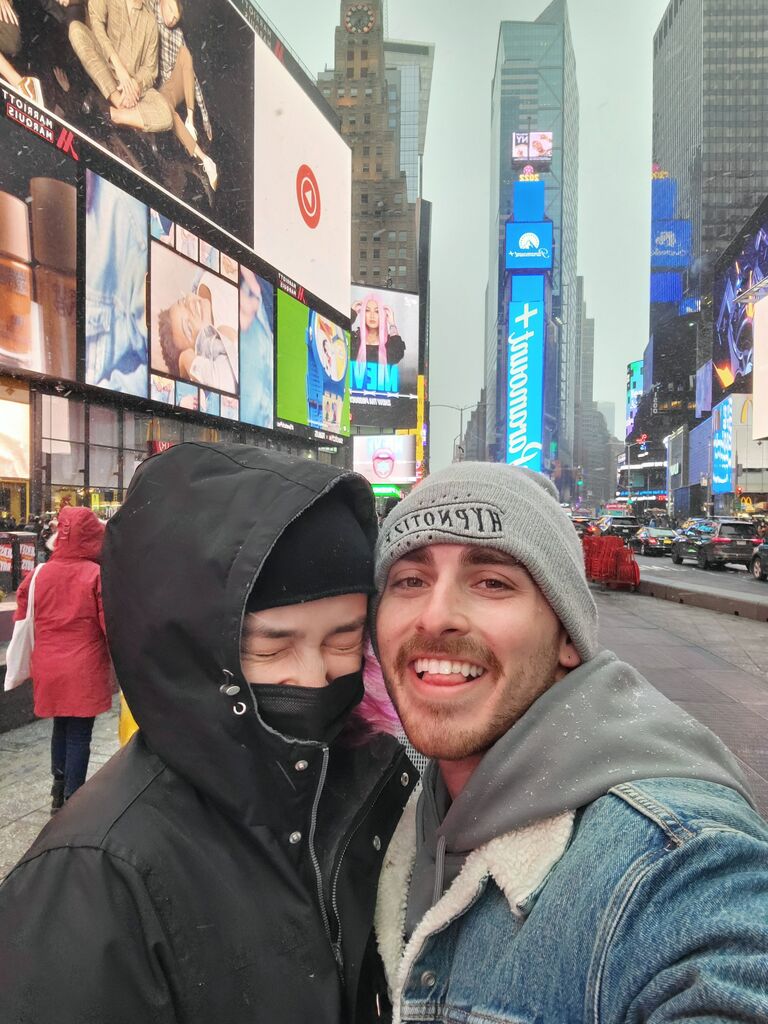 We both love to travel, and this is us freezing in Times Square. #Californiaweatheristhebest