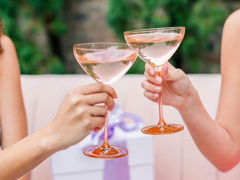 Couple toasting colored glassware martini glasses cool wedding gift idea