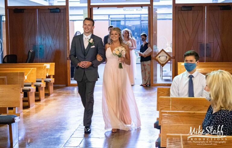 Walking down the aisle together for the first time- Kim and Josh's wedding!