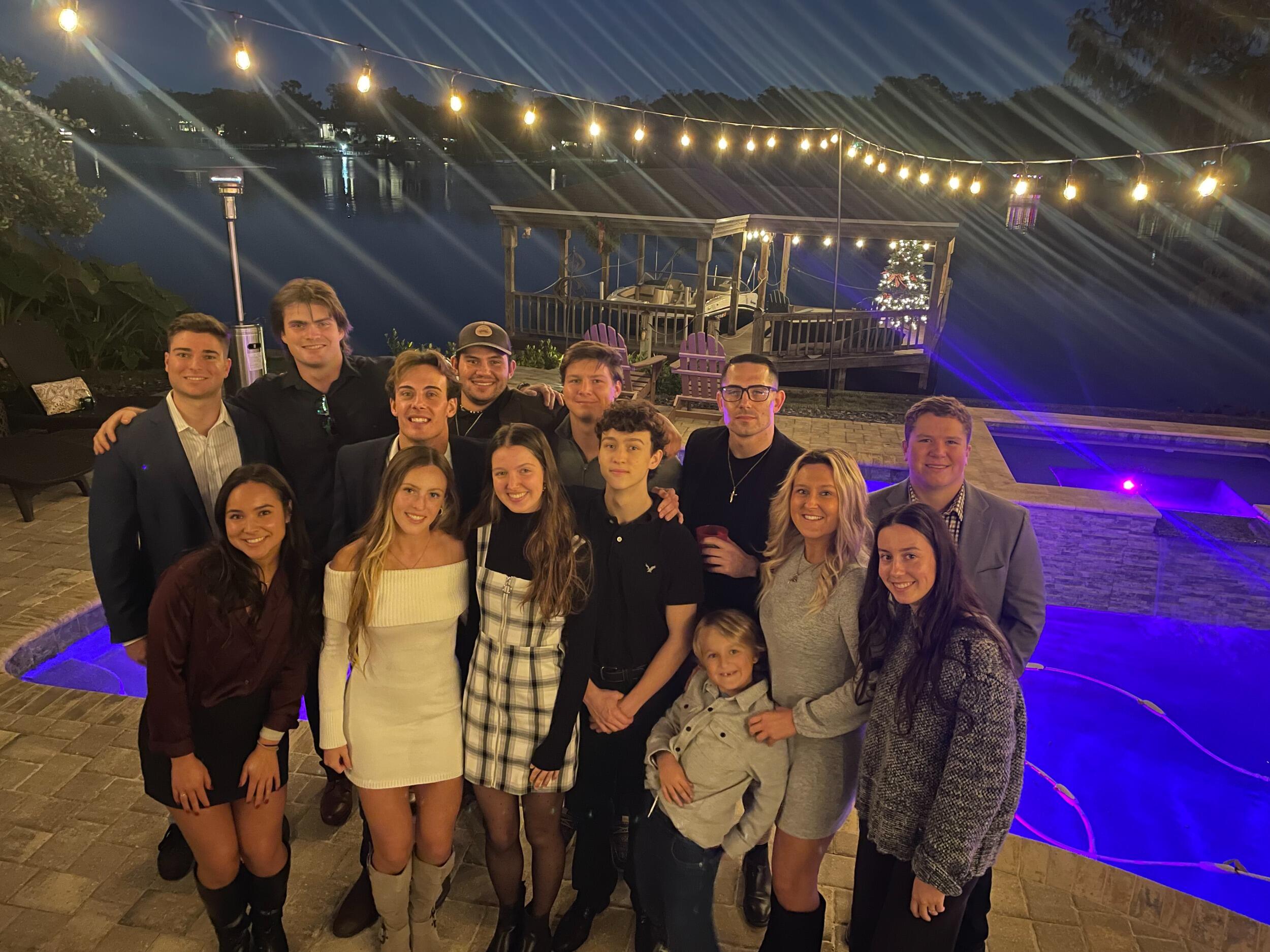 Emma, Brett, and their wedding party celebrating their engagement!