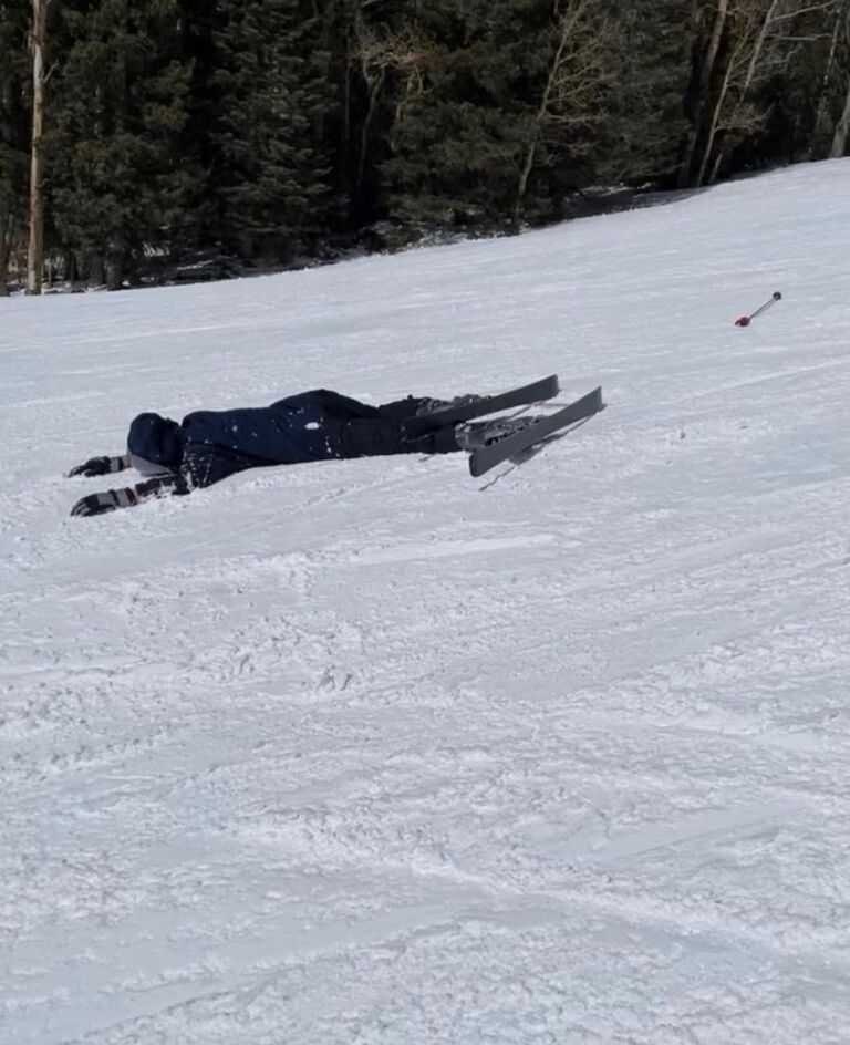 Katelyn teaches Daniel how to ski. 
