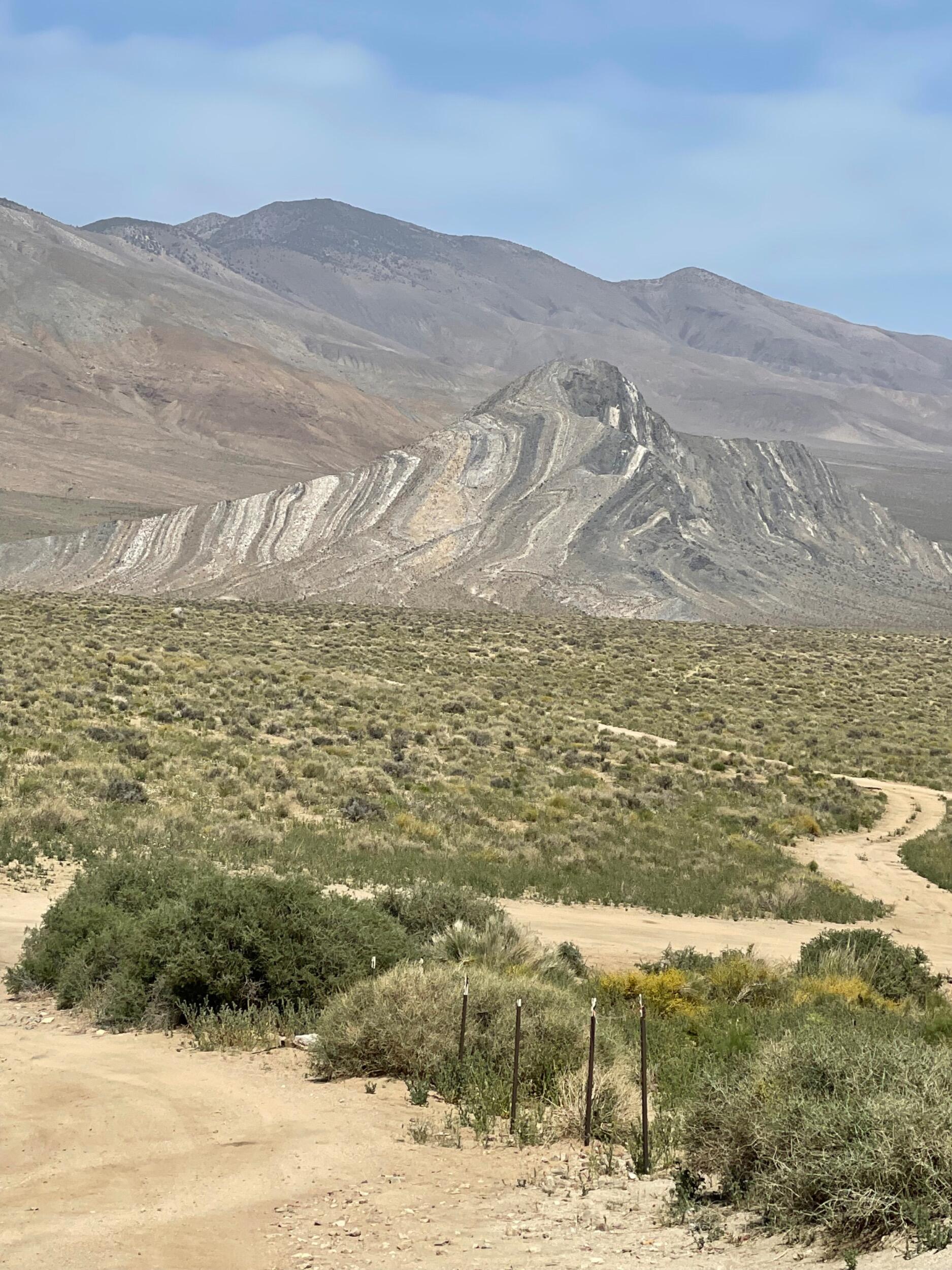 Picture of Striped Butte, located in Butte Valley, Death Valley National Park. David and Samantha first visited here in April 2022, as it is located in a very remote part of the park.  A year later, David proposed here while on a hike to the top!