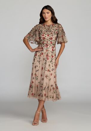 Embrace vintage-inspired glamour in this stunning hand-embellished midi dress. Sheer flutter sleeves, glimmering floral embellishments, and a soft ruffle hem make it the perfect dress for cocktail parties, weddings, or any event that calls for effortless elegance.