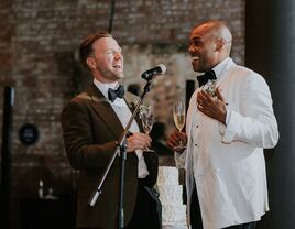 Grooms giving speech at wedding