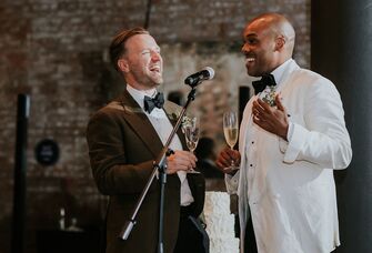 Grooms giving speech at wedding