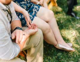 Couple holding wedding rings