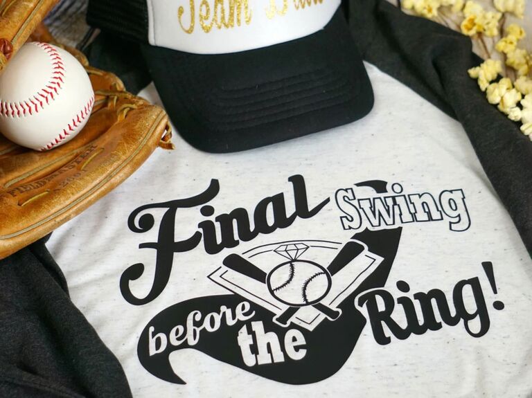Baseball-themed black bachelorette party shirt reading Final Swing Before The Ring!