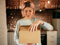 Woman holding a package from partner