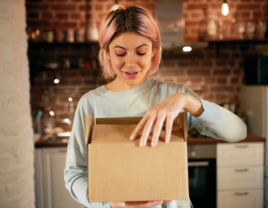 Woman holding a package from partner