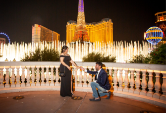 Man proposing to girlfriend in front of Bellagio fountains in Las Vegas