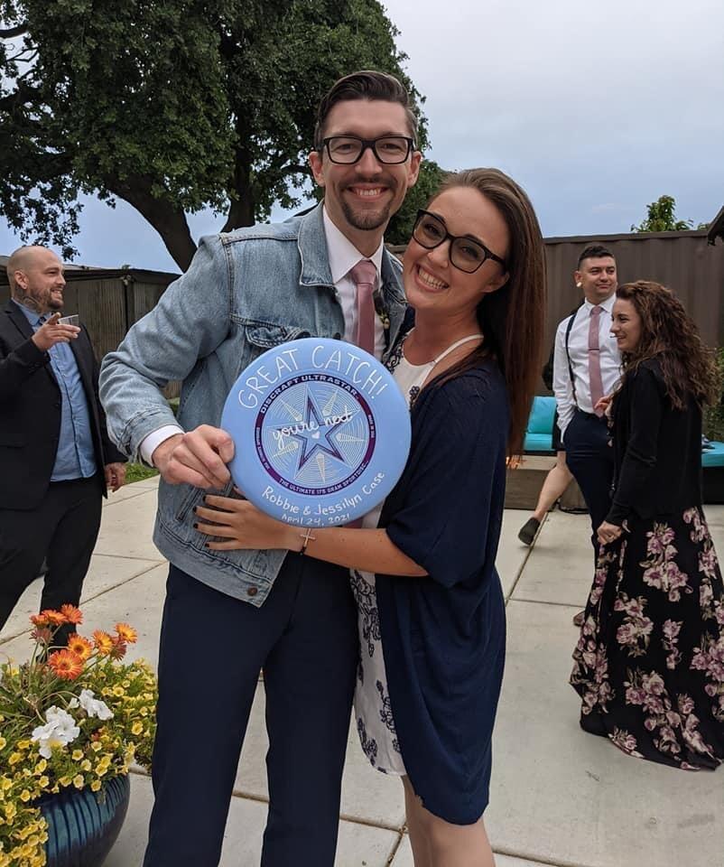He caught the frisbee at his brother's wedding. Says "You're Next," I think it knew ;) 