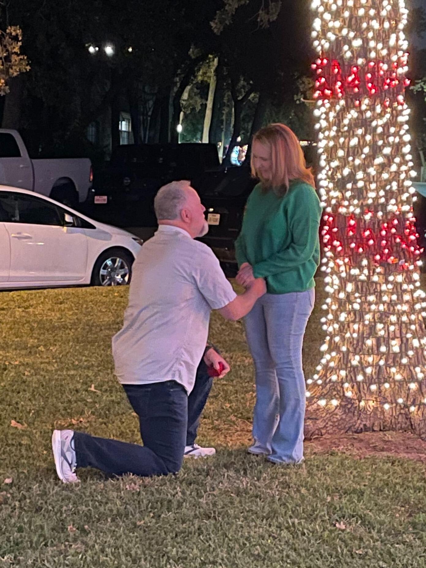 On Dave's 55th birthday, he quietly pulled me away from the party and led me outside.  His daughter Reagan discreetly captured the moment he asked me to be his wife.