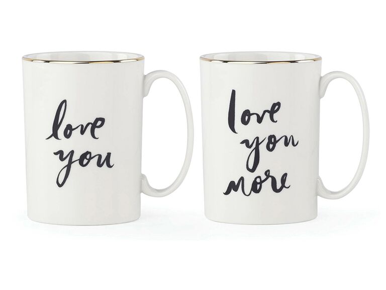 'love you' and 'love you more' in black script with gold rim on white mug