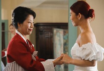 A bride and her mother share a tender moment together on the big day.