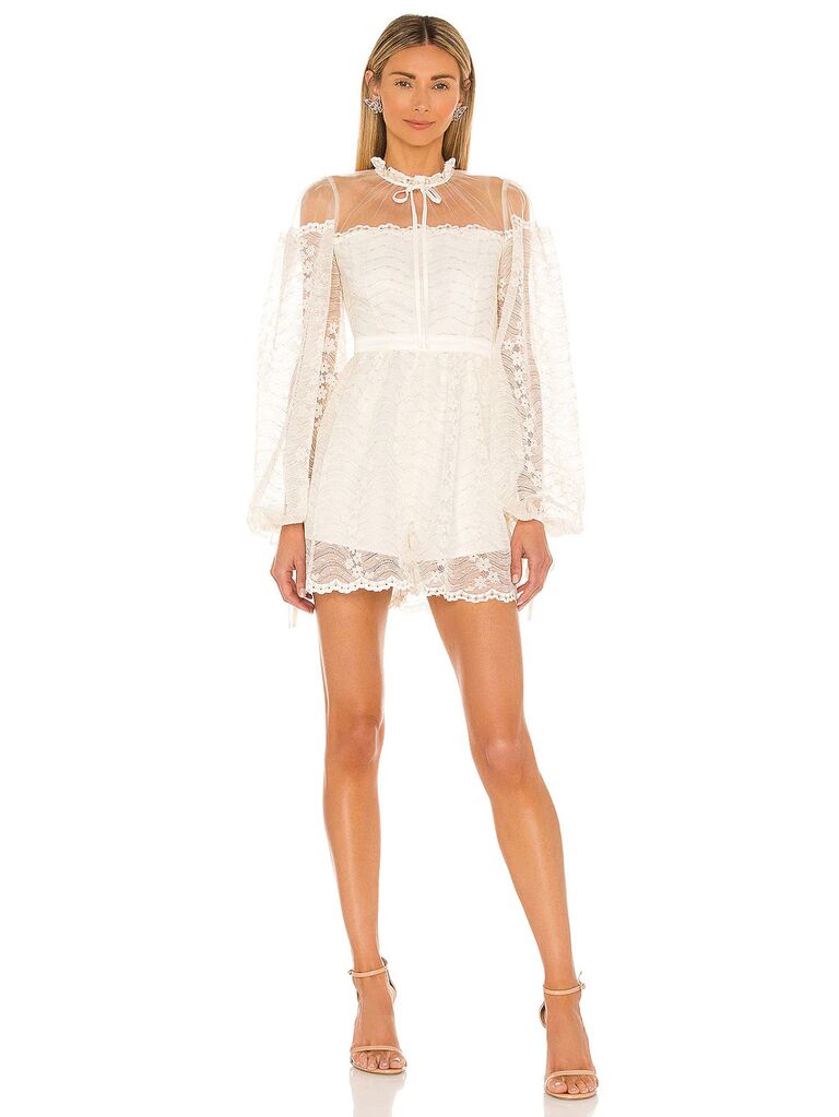 revolve cream colored bridal romper with mesh tied high neckline long puffy lace sleeves allover lace chest and shorts