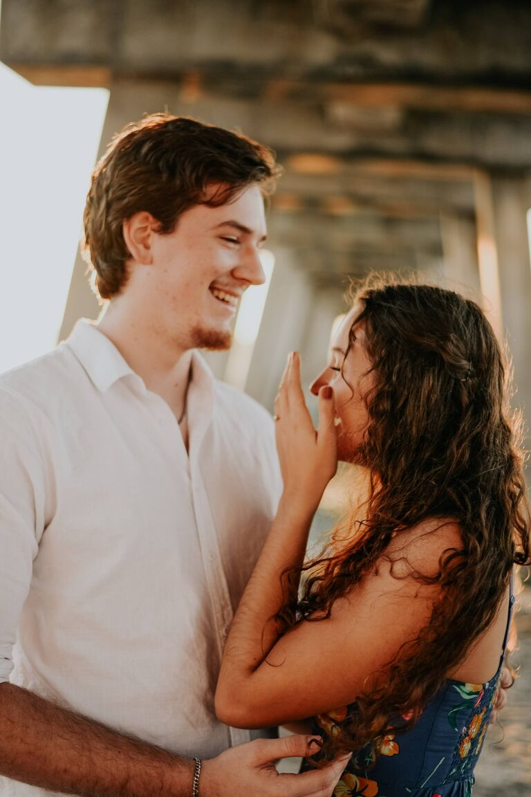 The day we got engaged. Dan took me out for a nice dinner at a restaurant on the beach, Walking on the beach before, he knelt down under the pier and proposed at sunset.