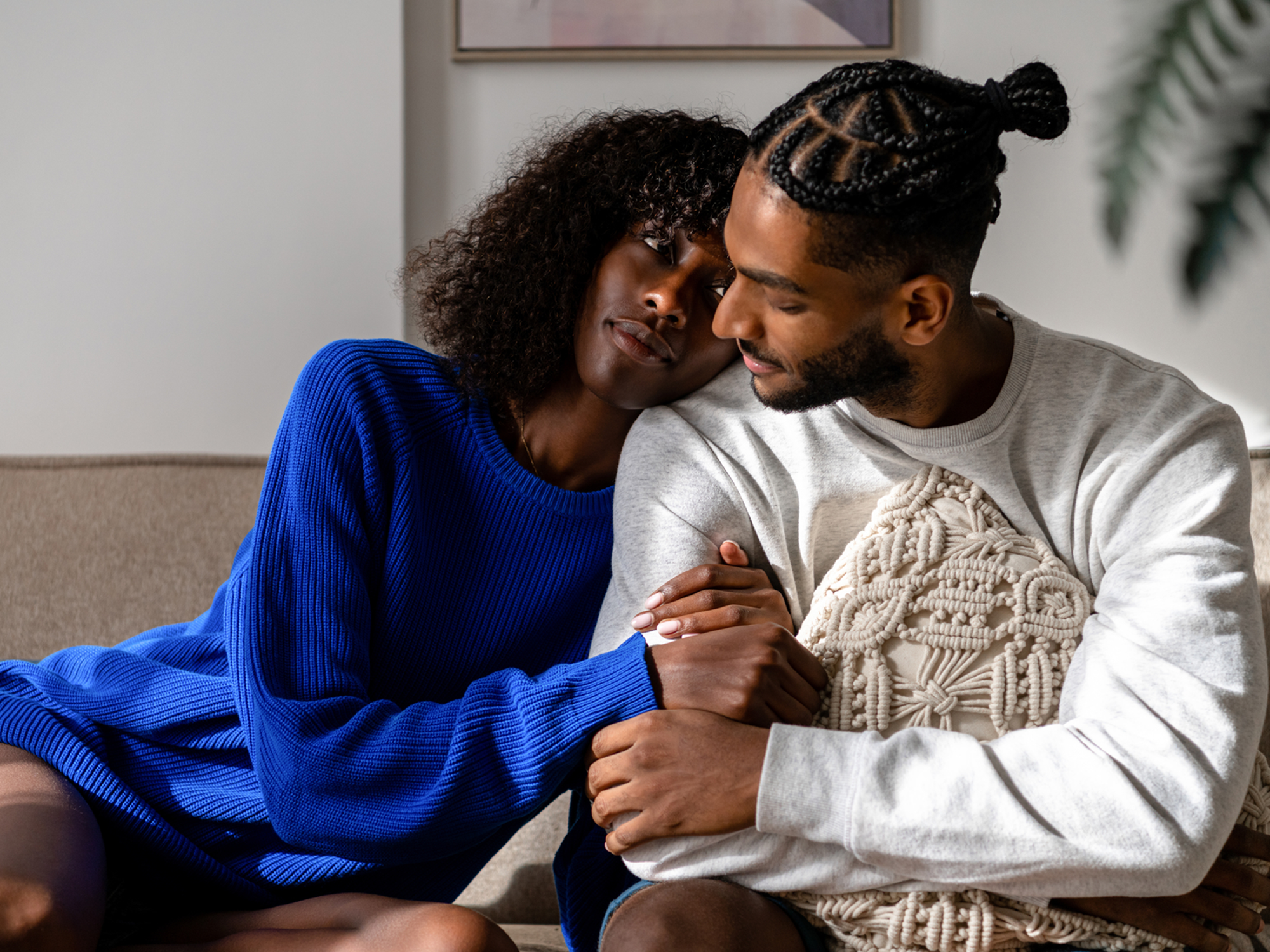 Woman laying head on man's shoulder