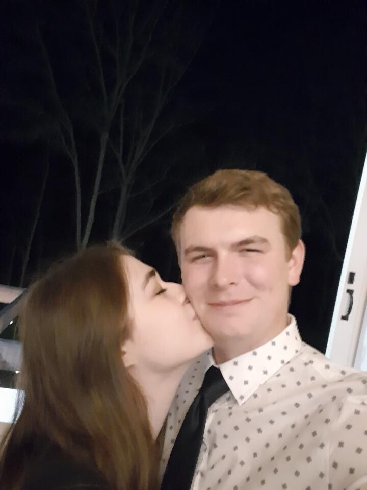 Matthew and Emily celebrating their friends' wedding right after Emily's graduation!