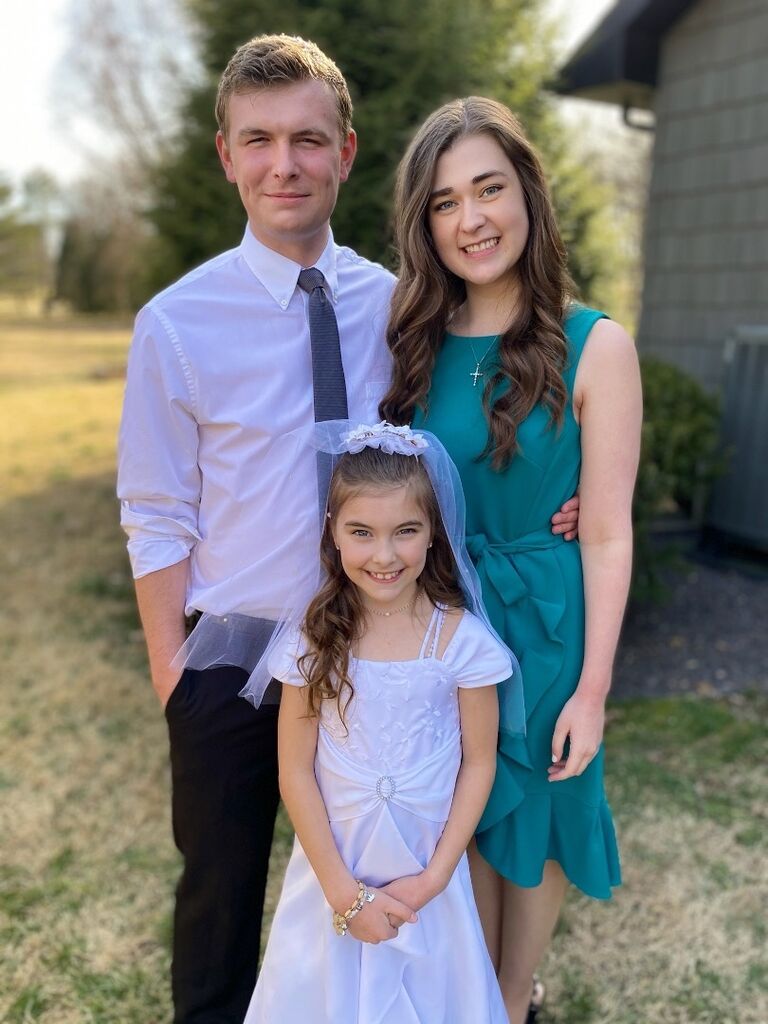 Matthew and Emily celebrating Ella's First Communion (Matthew's little sister). Emily met Matthew's family that day!