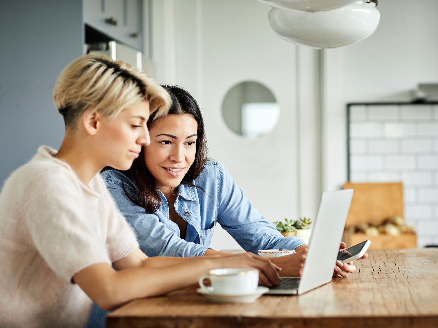 Couple planning their wedding on laptop