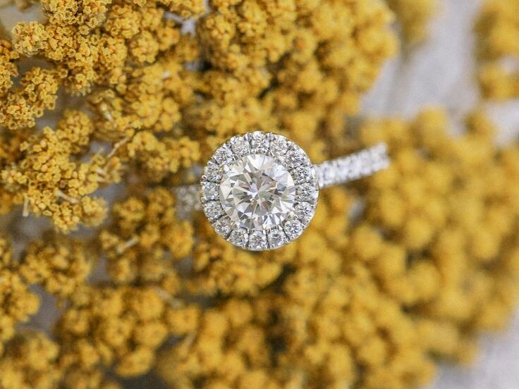 engagement ring styled atop bunch of yarrow