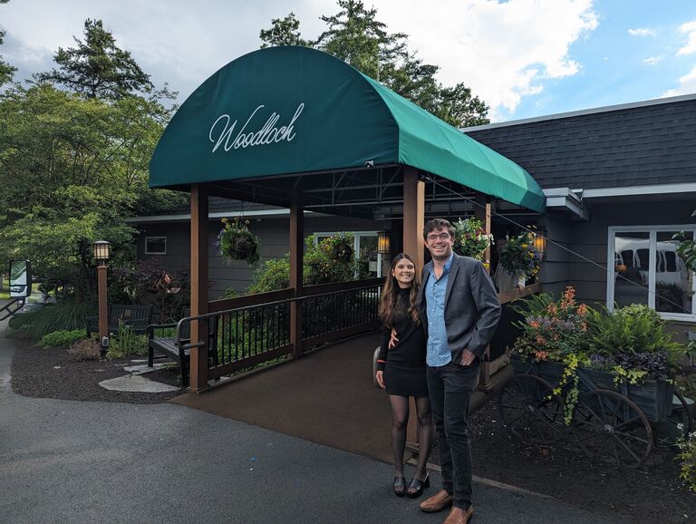 James and Tash at the entrance of Woodloch Pines celebrating with the Cappuzzo families