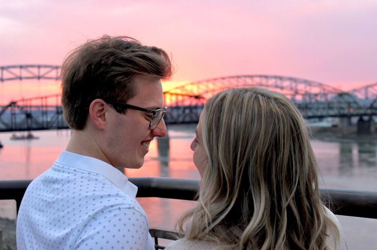 Lindsay: "On March 4, 2022, with the help of family and friends, Nick completely surprised me when he proposed near KC's River Market overlooking the Missouri River. Following the proposal, I quickly learned that he had arranged a surprise engagement party with all of our closest family and friends, which was so incredibly special."