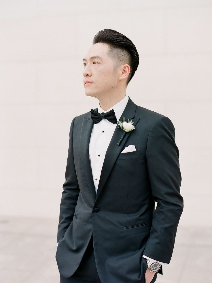 Groom in tux with white boutonniere