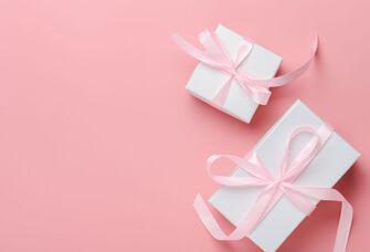 Wrapped bridal shower gift and wedding gift with pink bows